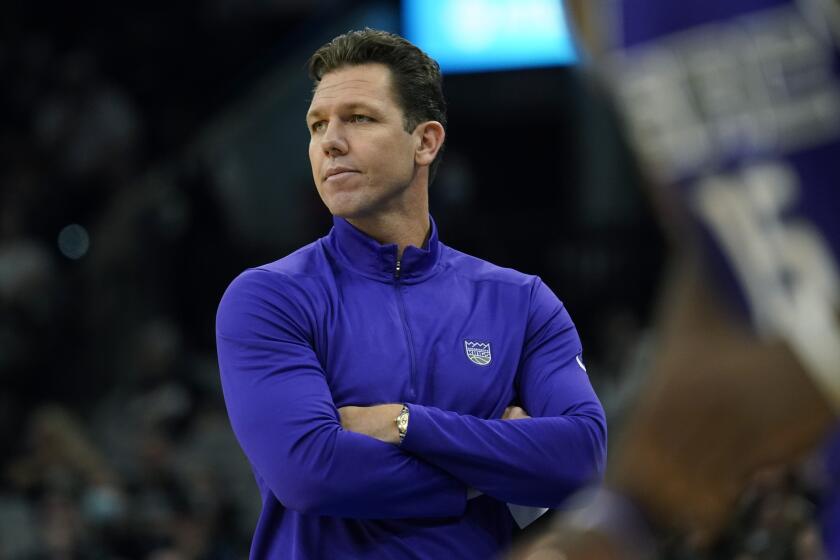 Sacramento Kings head coach Luke Walton watches from the side lines during the first half of an NBA basketball game against the San Antonio Spurs, Wednesday, Nov. 10, 2021, in San Antonio. (AP Photo/Eric Gay)