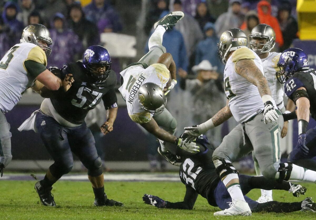 TCU's Travis Howard (32) upends Baylor running back Johnny Jefferson during a game in 2016.