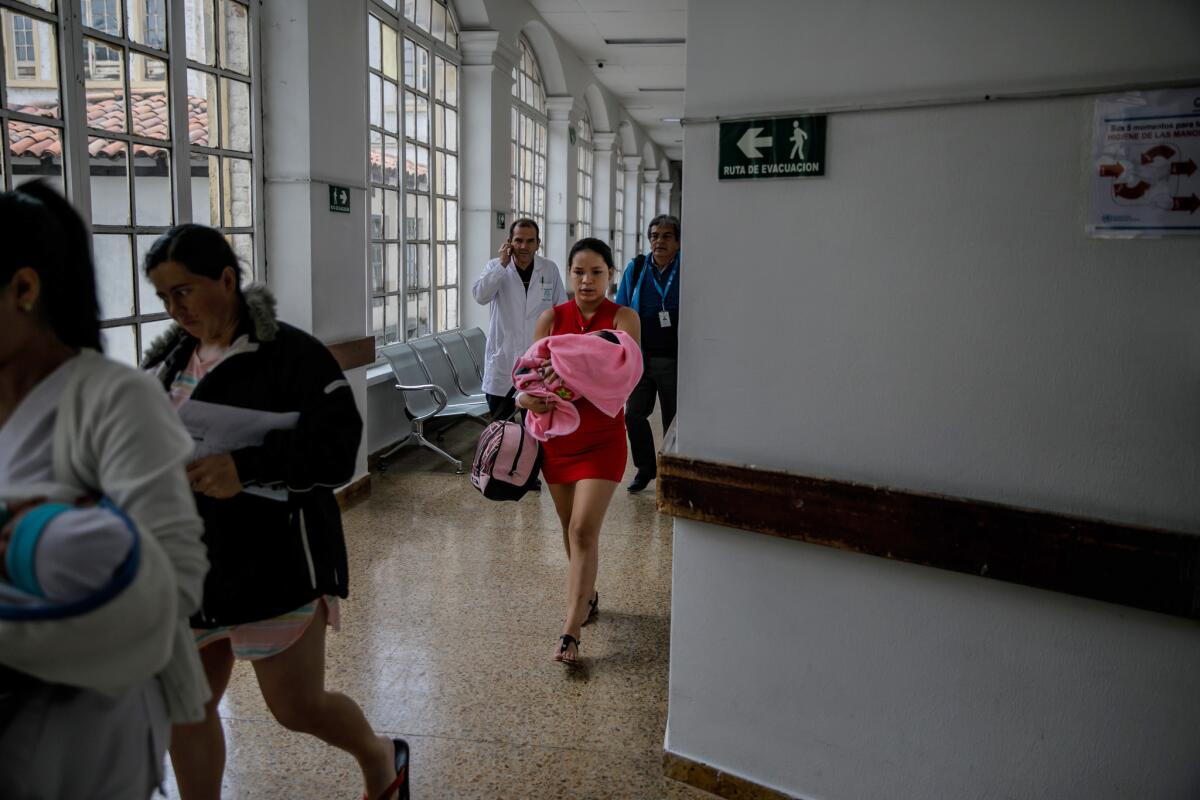 Venezuelan Juberkis Alvarez Guanipa, 19 and her newborn Dariagnny are discharged from the Hospital Materno Infantil in Bogota, Colombia, on May 3, 2019.