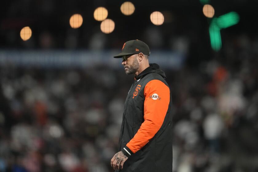 San Francisco Giants manager Gabe Kapler walks to the dugout after making a pitching change during the seventh inning of a baseball game against the San Diego Padres in San Francisco, Wednesday, Sept. 27, 2023. (AP Photo/Jeff Chiu)