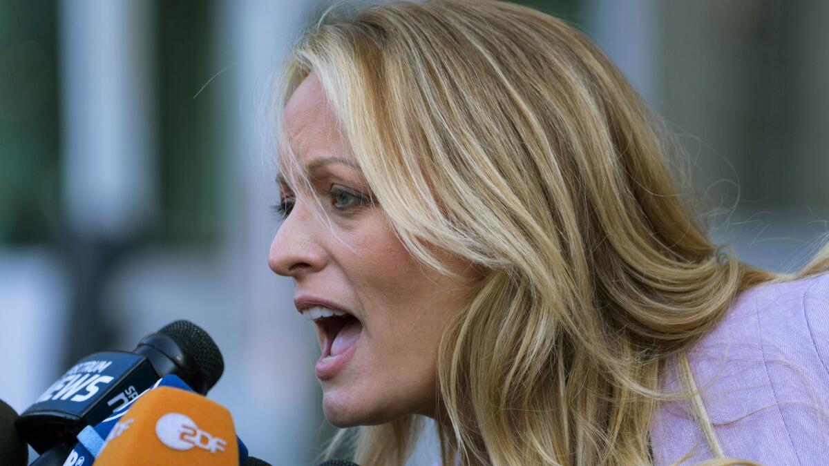 Adult film actress Stormy Daniels speaks to the media outside court in New York.