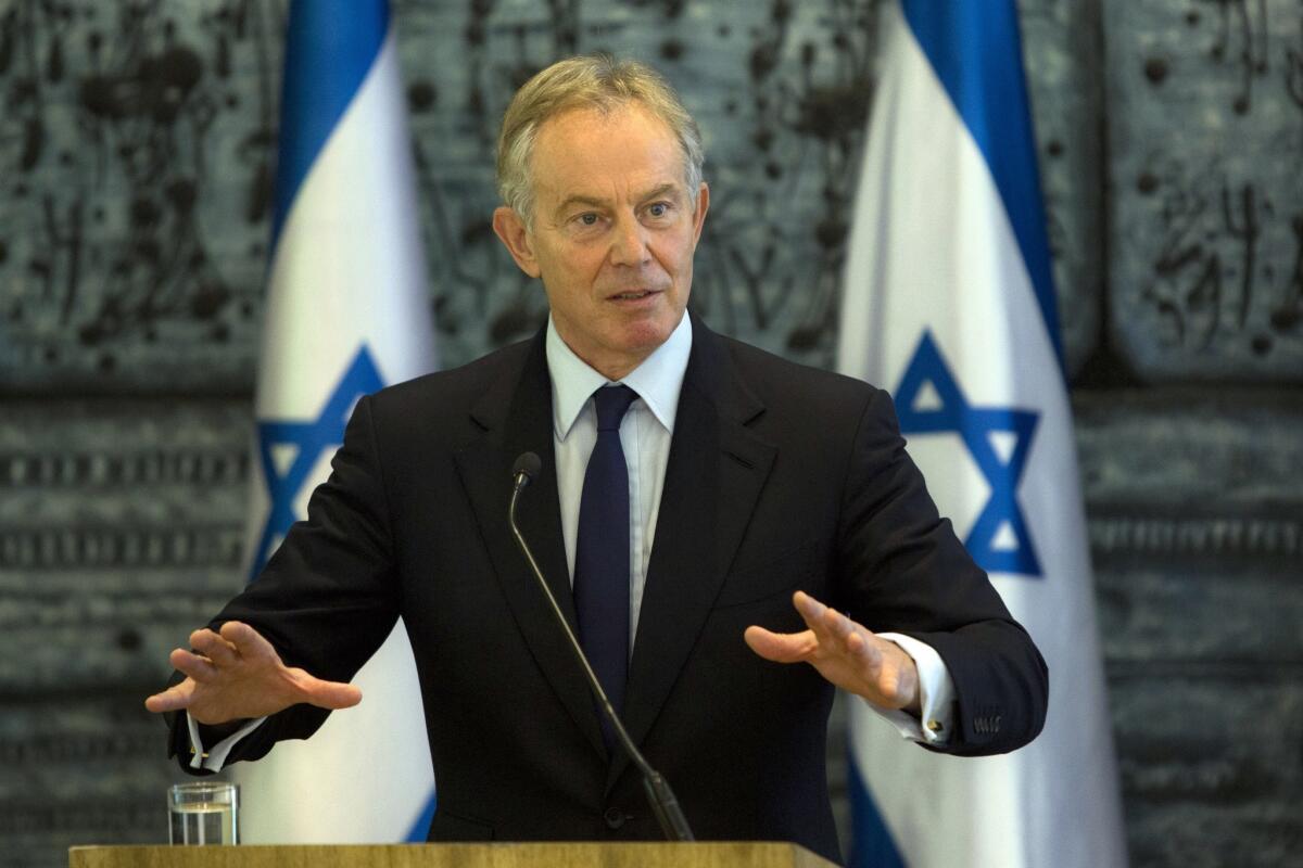 Former British Prime Minister Tony Blair, shown here during a Jerusalem visit in July 2014, has informed the U.N. chief that he will step down from his role as the world body's special Middle East envoy next month, according to media reports.