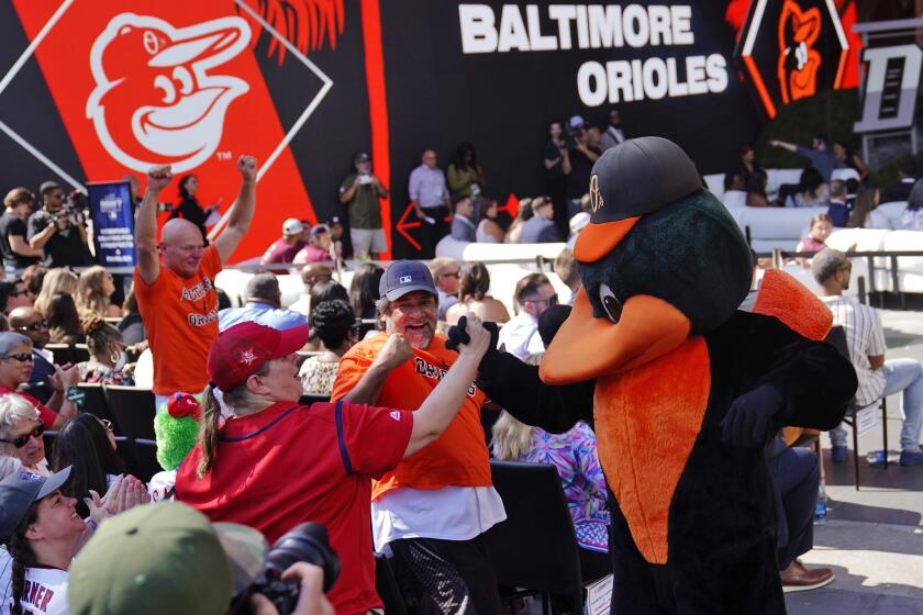 The Baltimore Orioles mascot greets fans during the 2022 MLB baseball draft, Sunday, July 17, 2022.