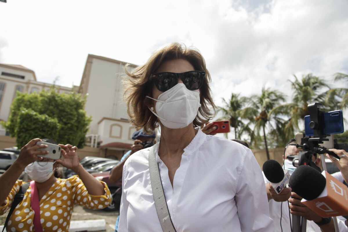 Cristiana Chamorro, in mask and sunglasses