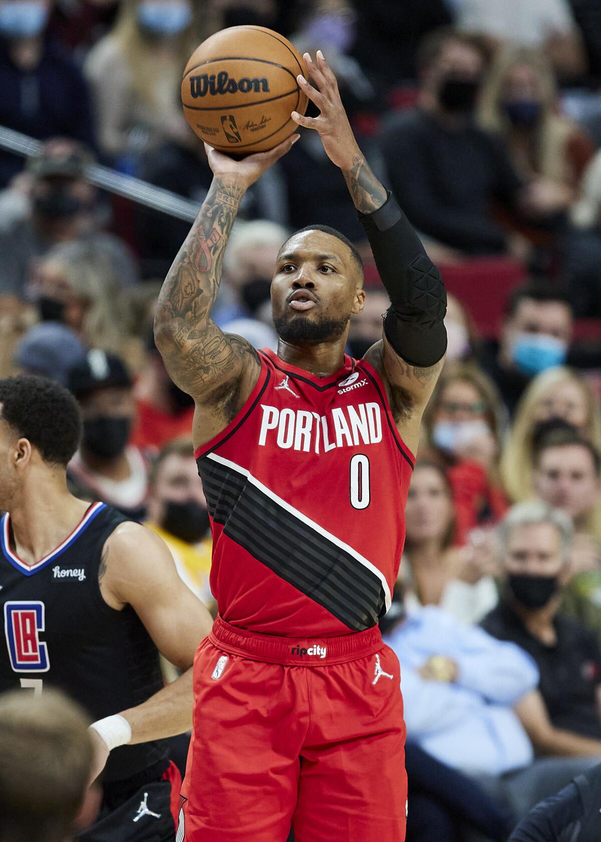 Portland guard Damian Lillard shoots against the Clippers on Oct. 29, 2021.
