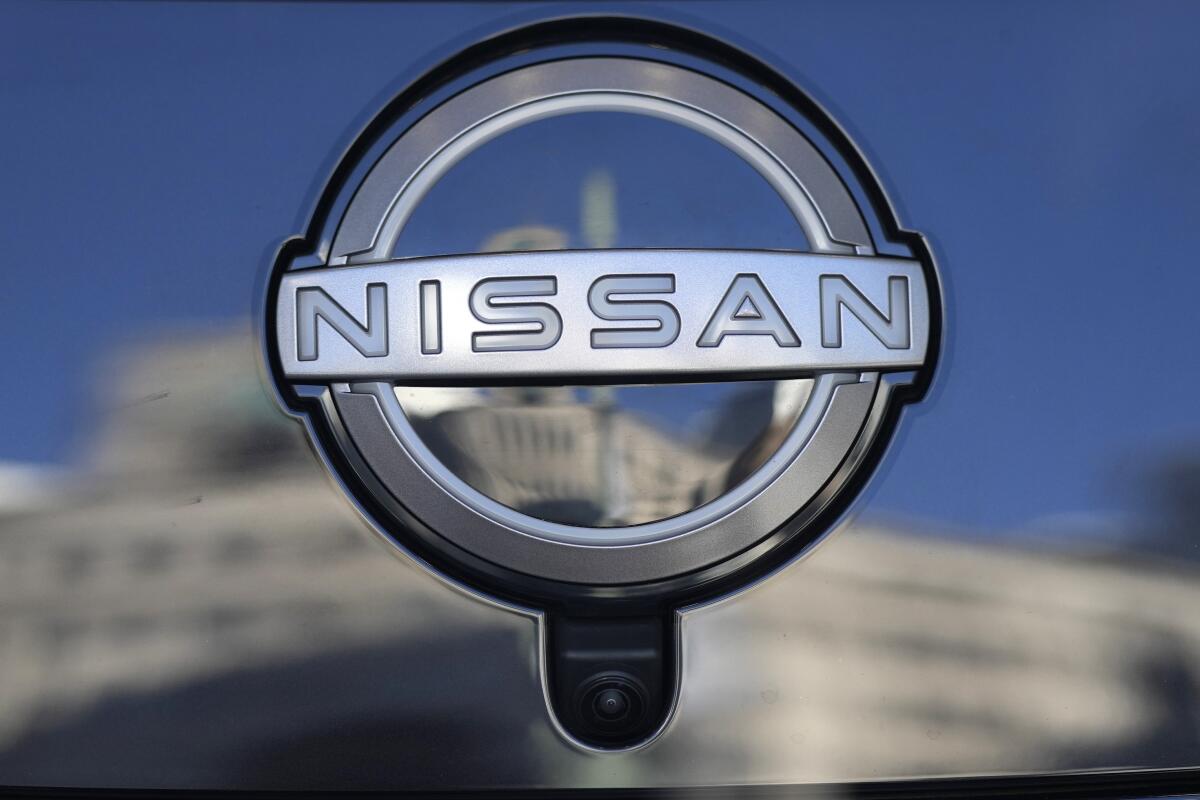 A Nissan logo is seen on a car at its showroom in Tokyo, Feb. 21, 2023. 