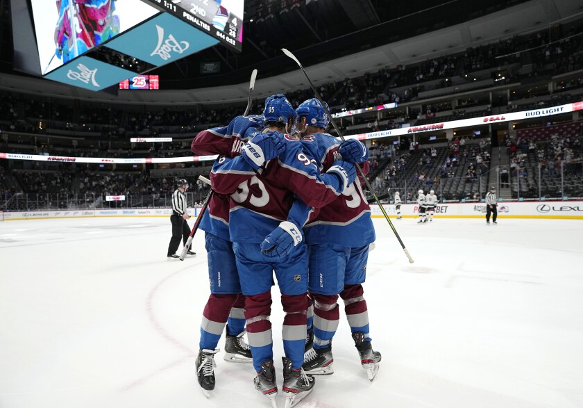 Members of the Colorado Avalanche celebrate a goal against the Los Angeles Kings during the second period of an NHL hockey game Thursday, May, 13, 2021, in Denver. (AP Photo/Jack Dempsey)
