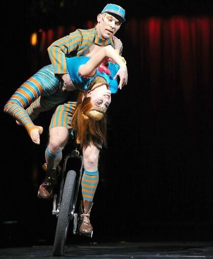 Performers show their unicycle skills on stage.