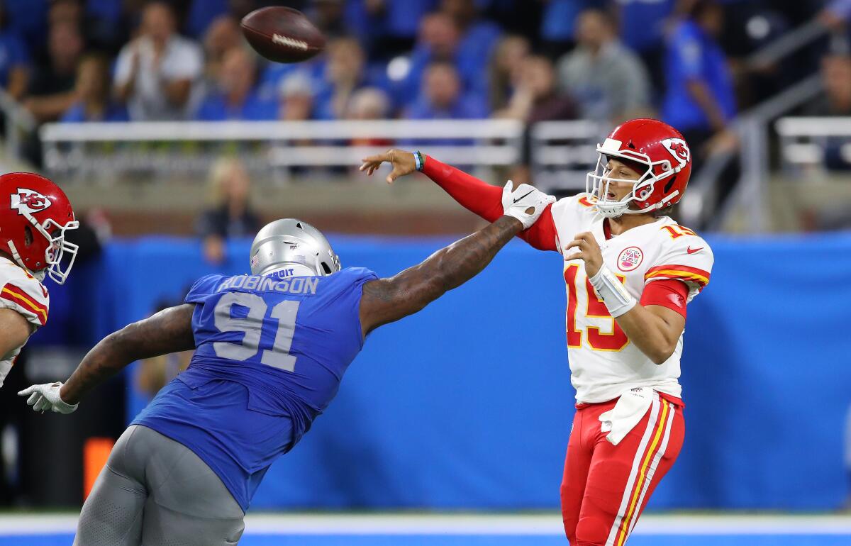 Kansas City Chiefs quarterback Patrick Mahomes passes over Detroit Lions defensive tackle A'Shawn Robinson during the fourth quarter.
