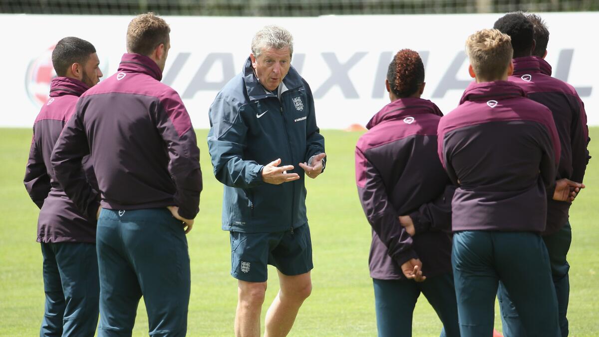 England Coach Roy Hodgson speaks to his players during a World Cup training session in Algarve, Portugal, on Wednesday.