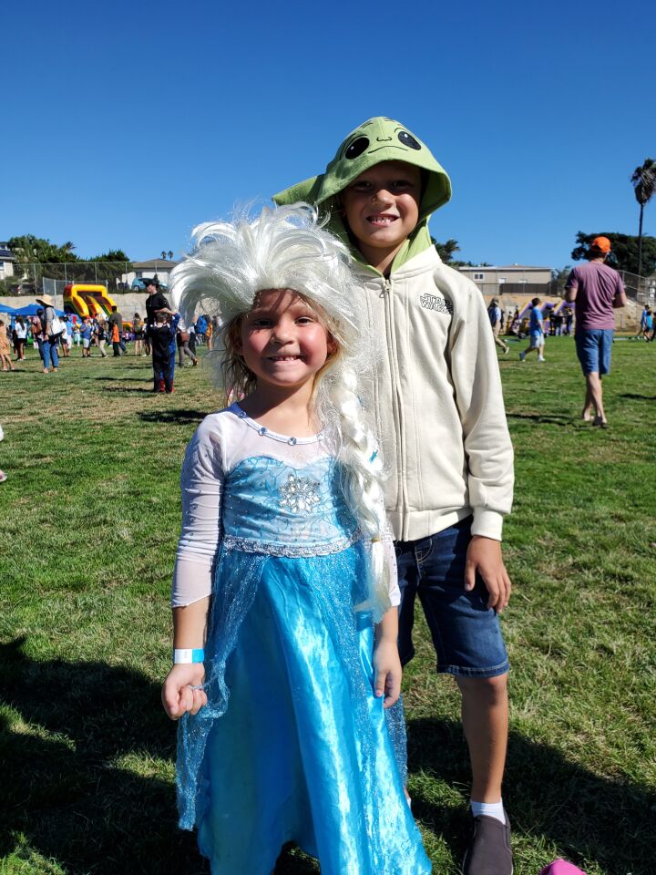 Mae and Noah Van Zeeland show their costumes during the Bird Rock Foundation Fall Festival. She's Princess Elsa from Disney's "Frozen" and he's Yoda from the "Star Wars" movies.