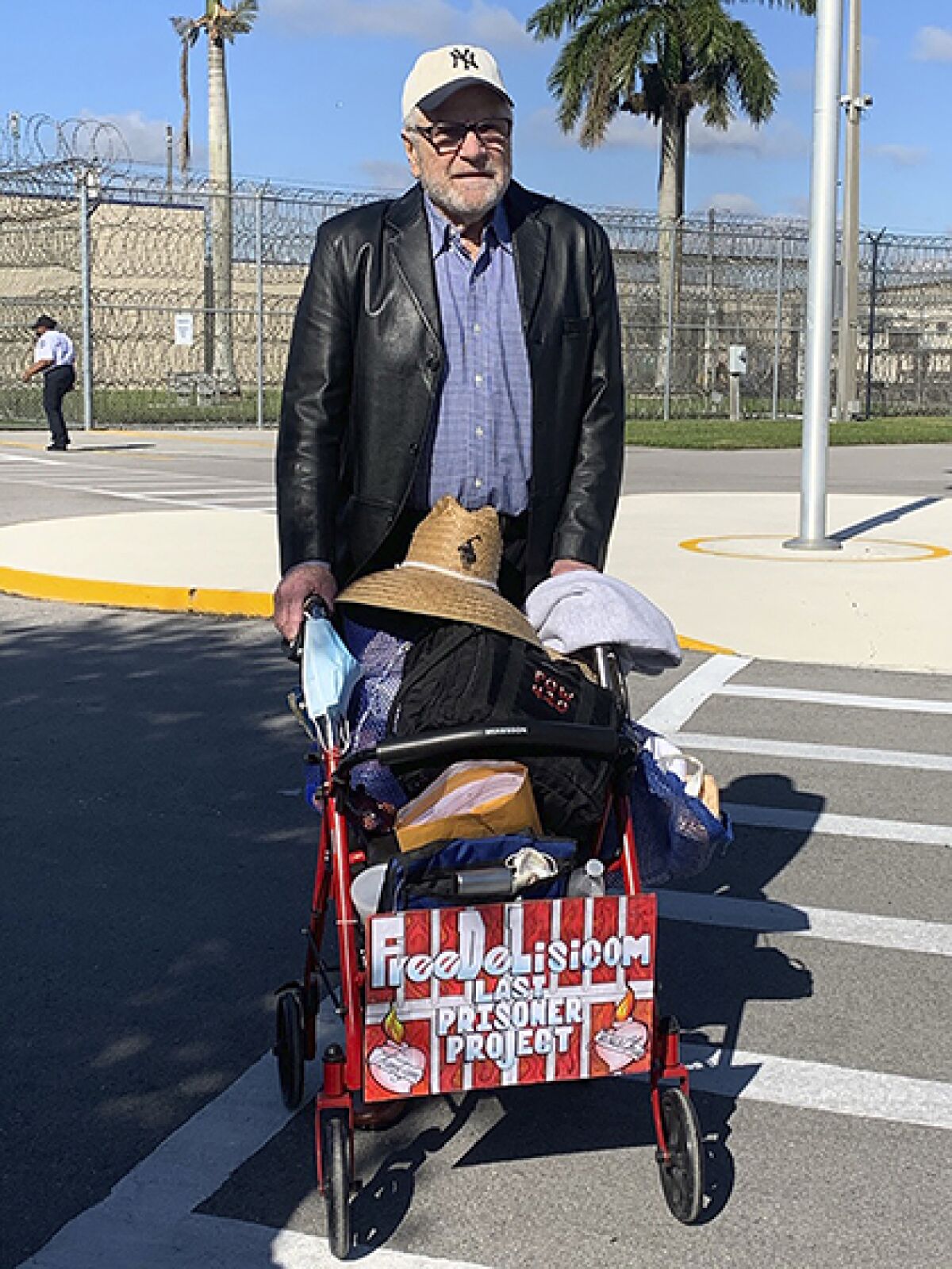 Richard DeLisi exits a Florida prison with his possessions on Tuesday.