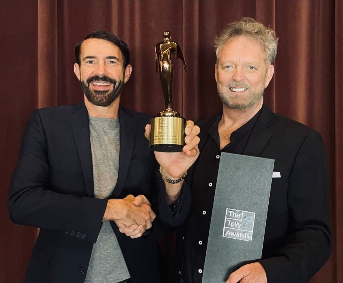 Doug Lito and Don Meredith with the 2022 Telly Award for “The Signal.”