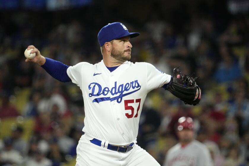 Dodgers relief pitcher Ryan Brasier throws against the Angels on  July 7, 2023, in Los Angeles.