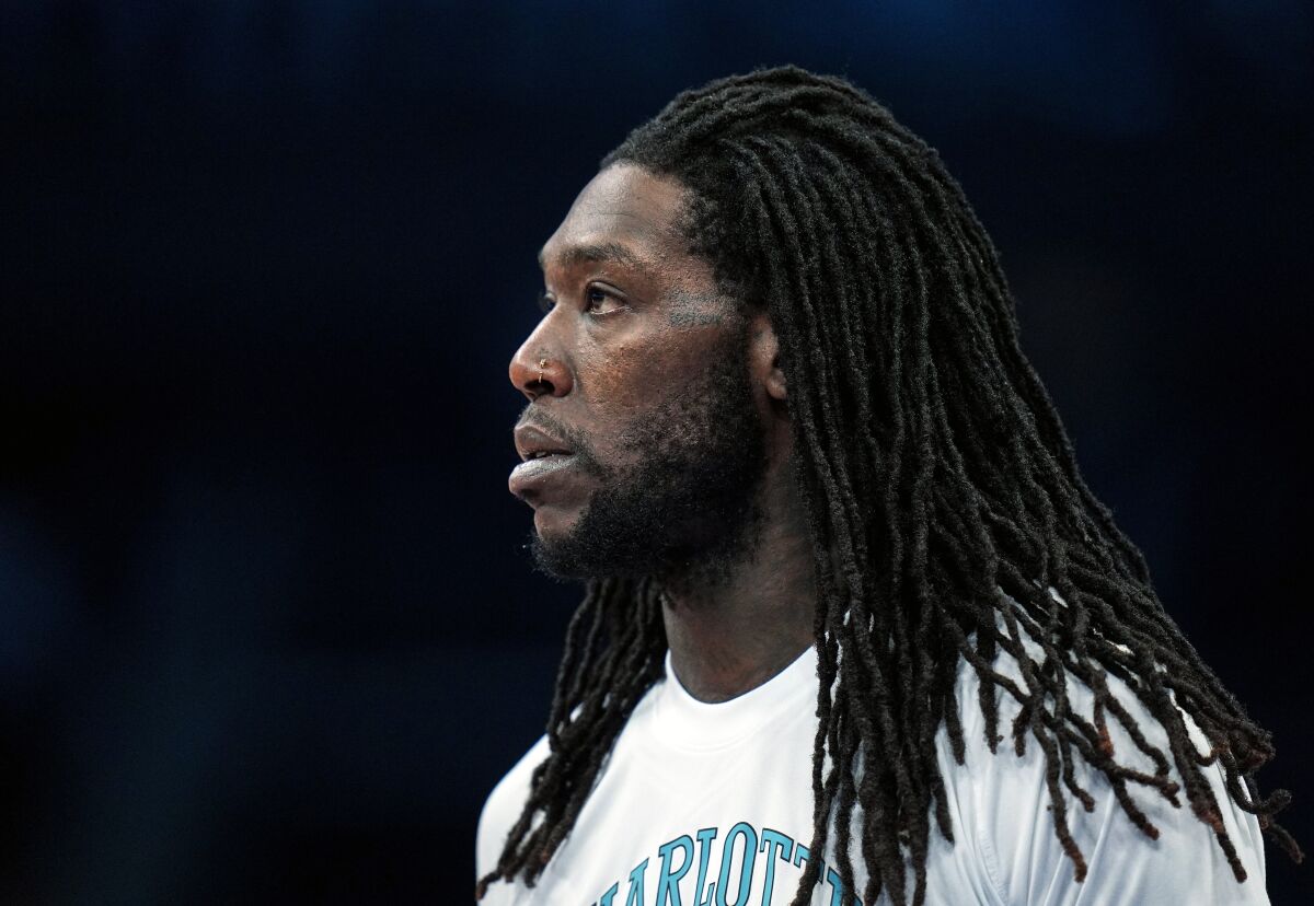 FILE - Charlotte Hornets center Montrezl Harrell (8) warms up prior to an NBA basketball game against the Dallas Mavericks on Saturday, March 19, 2022, in Charlotte, N.C. Harrell is facing a felony drug charge after authorities said they found vacuum-sealed bags of marijuana in his car during a traffic stop. According to court records, the 28-year-old Harrell was pulled over in Richmond, Ky., by a state trooper May 12, 2022, for driving behind a vehicle too closely. (AP Photo/Rusty Jones, File)
