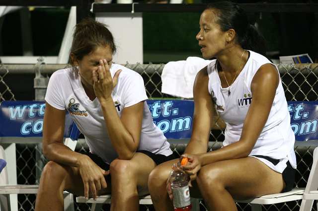 The Newport Beach Breakers' Marie-Eve Pelletier, left, and Anne Keothavong sit on the bench following a loss to St. Louis Aces' Maria Sanchez and Liezel Huber.