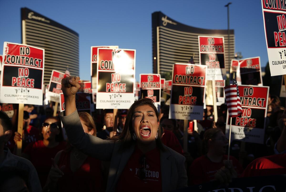 Picketers chant at a demonstration organized by the Culinary Union outside the Trump International Hotel in Las Vegas.