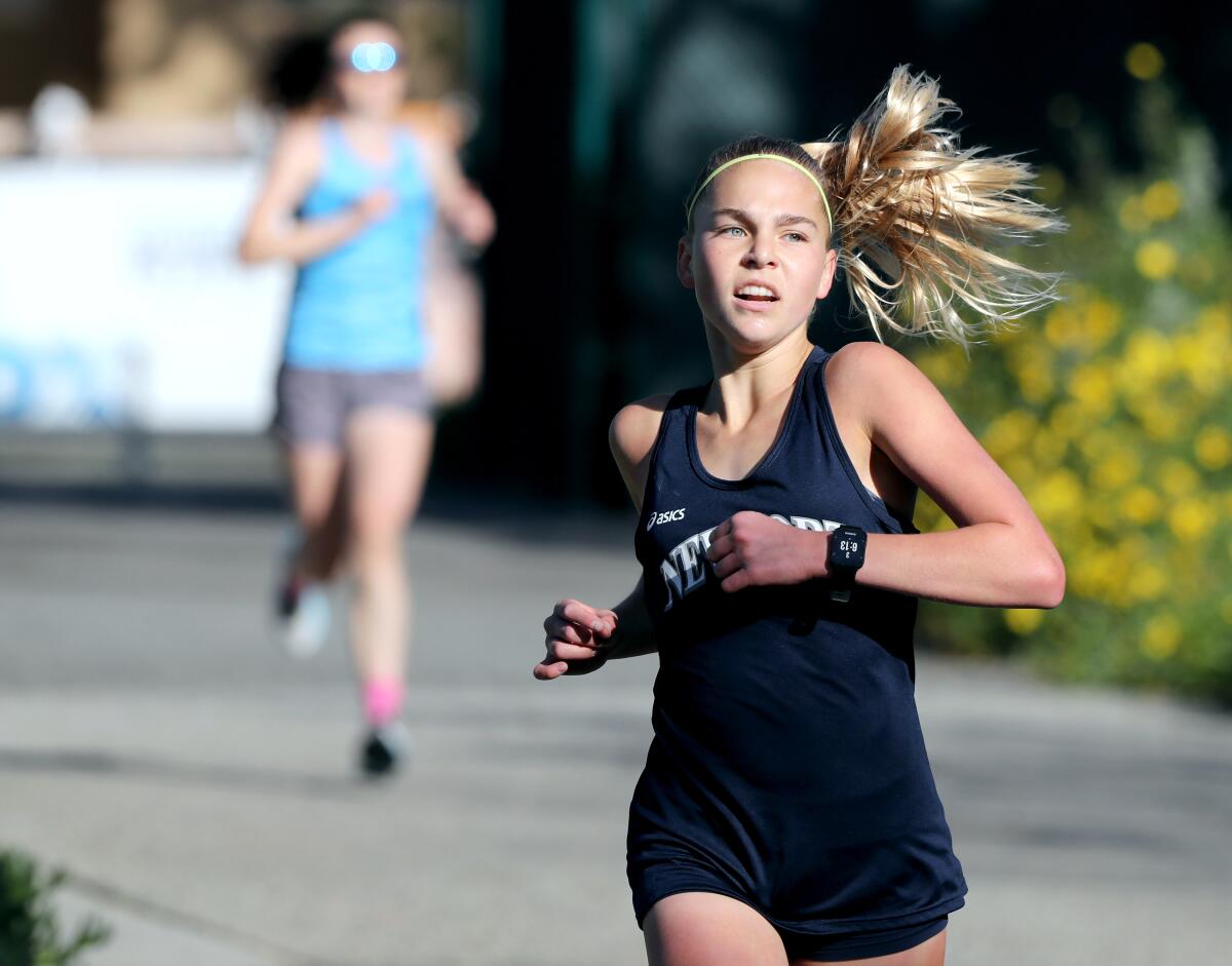Newport Harbor's Emma Scheumann wins the girls' varsity cross-country race against Corona del Mar.