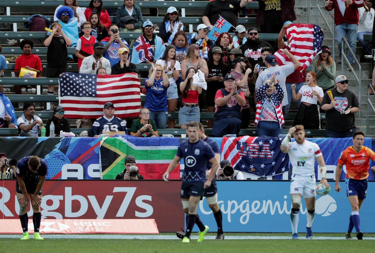 American fans cheer after the U.S. Eagles' Steve Tomasin, right, scores against Scotland on Feb. 29, 2020, at the HSBC World Rugby Sevens tournament. 