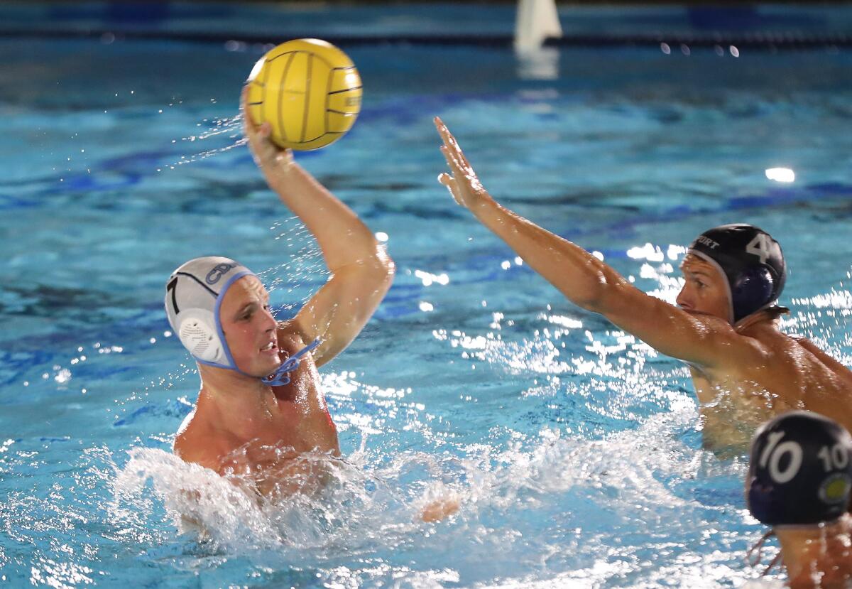 Corona del Mar's Luke Zimmerman shoots and scores after halftime of Friday night's Battle of the Bay water polo match
