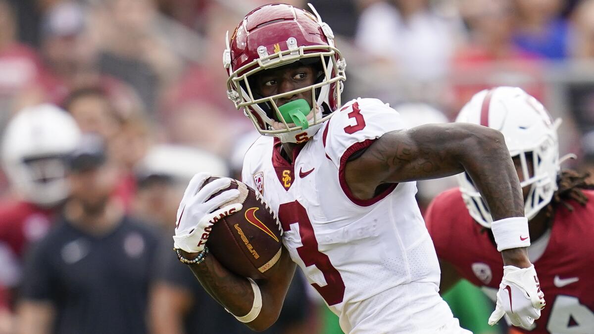 USC wide receiver Jordan Addison runs after catching a pass to score a 22-yard touchdown.