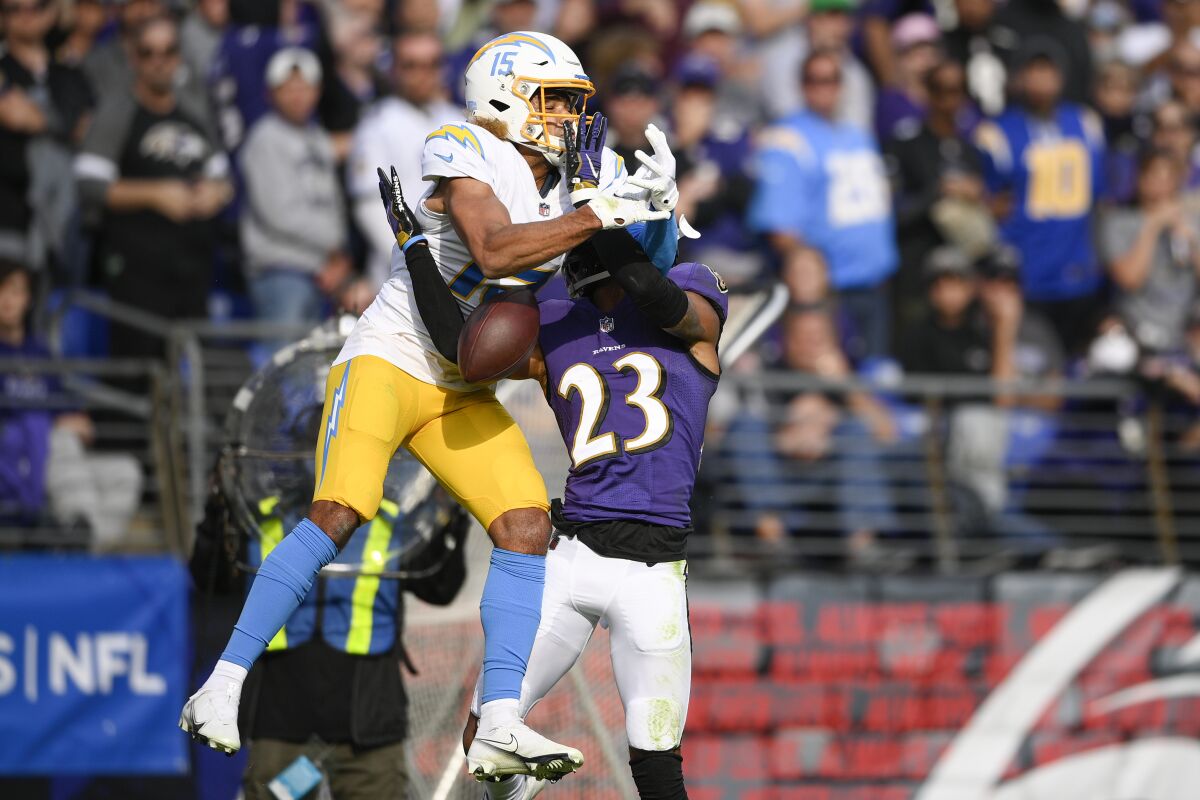 Ravens cornerback Anthony Averett breaks up a pass intended for Chargers wide receiver Jalen Guyton.