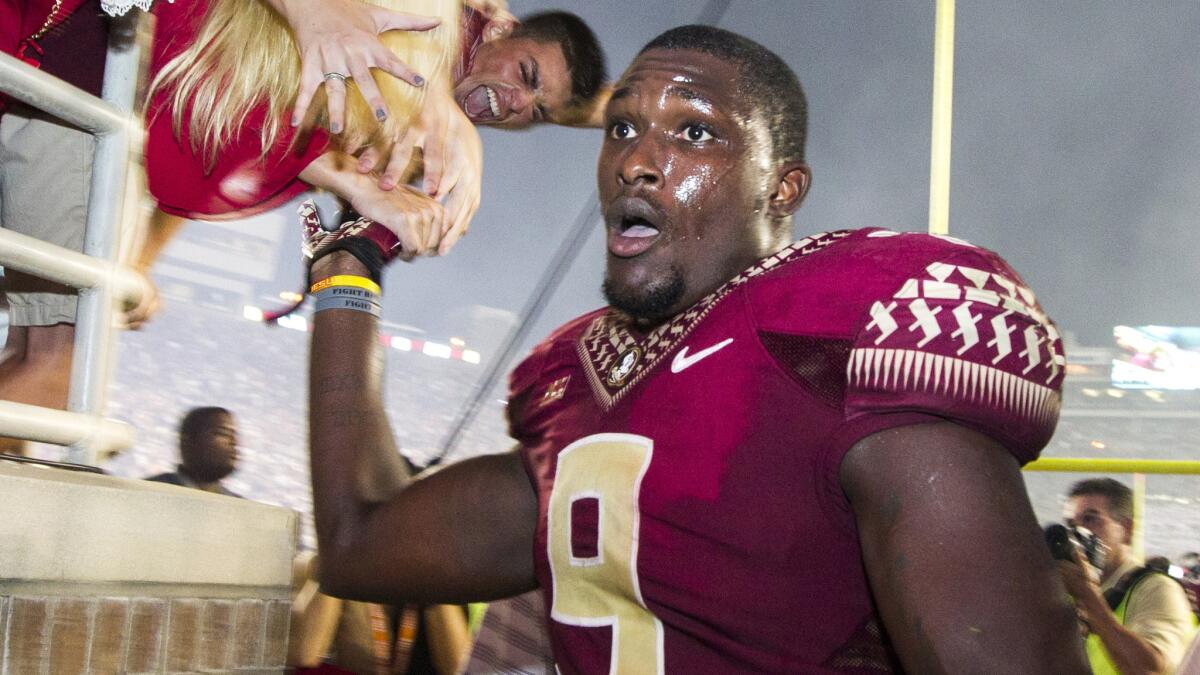 Florida State running back Karlos Williams greets fans after a victory over Clemson on Sept. 20.