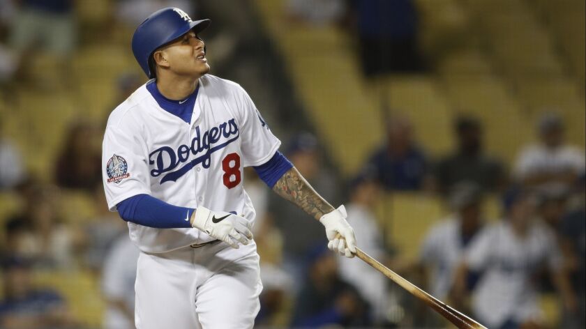 Dodgers four-time all-star infielder Manny Machado hits a home run in the ninth inning as he makes his first appearance at Dodger Stadium since he was acquired in a July 18 trade with the Baltimore Orioles.