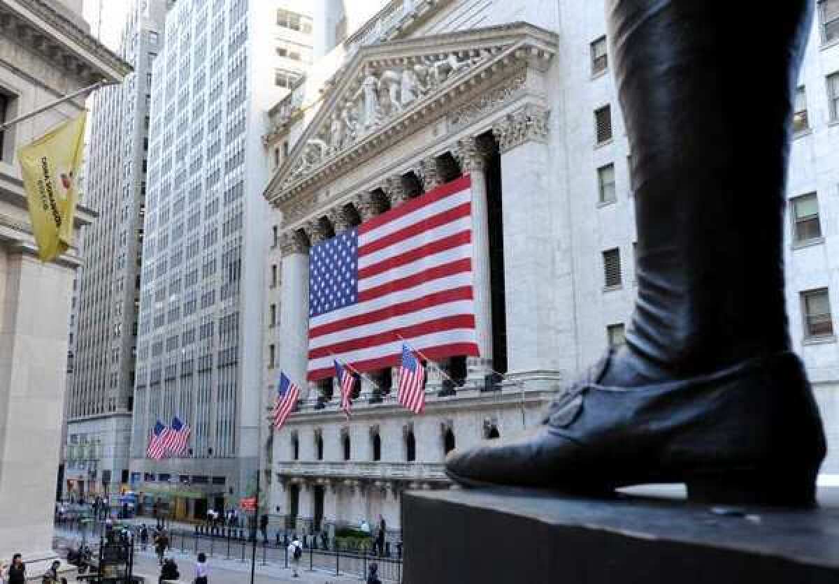 Stocks hit new all-time highs after reassuring comments from Fed chief Ben S. Bernanke. Above, the New York Stock Exchange in Lower Manhattan and the boot of the nearby statue of George Washington.
