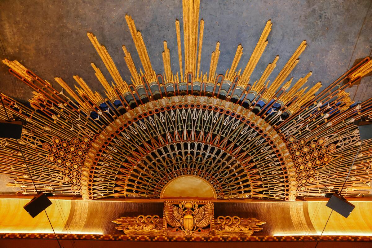 Egyptian sunburst design on the ceiling of the theater.