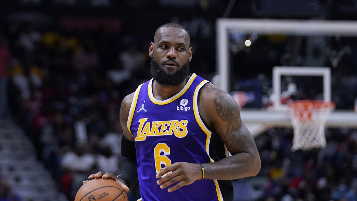 Lakers forward LeBron James controls the ball during a loss to the New Orleans Pelicans on Sunday.