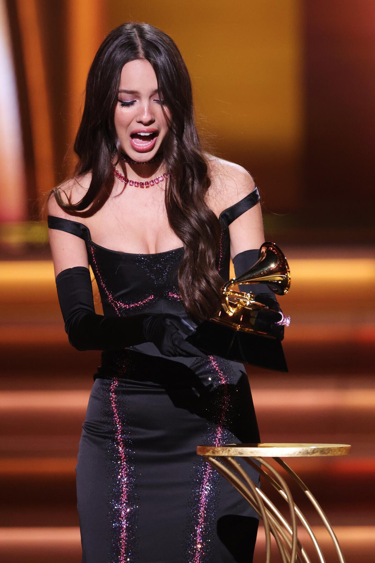Olivia Rodrigo accepts the best new artist award onstage during the 64th Grammy Awards.