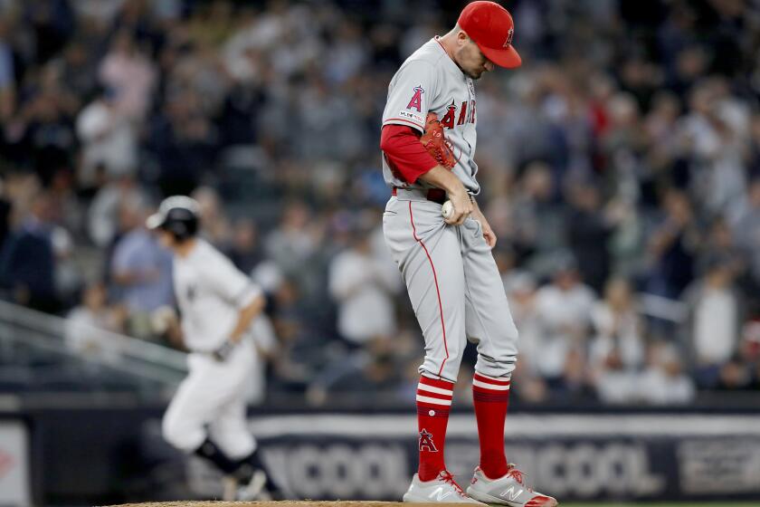 NEW YORK, NEW YORK - SEPTEMBER 19: Andrew Heaney #28 of the Los Angeles Angels reacts as DJ LeMahieu #26 of the New York Yankees rounds third base after his three run home run in the second inning at Yankee Stadium on September 19, 2019 in Bronx borough of New York City. (Photo by Elsa/Getty Images) ** OUTS - ELSENT, FPG, CM - OUTS * NM, PH, VA if sourced by CT, LA or MoD **
