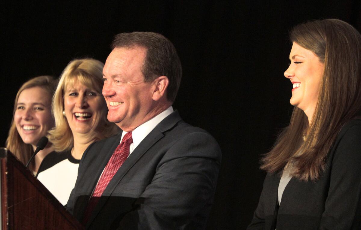 Jim McDonnell with wife, Kathy, and daughters Kelly, right, and Megan, left, at the JW Marriott in Los Angeles for election night.