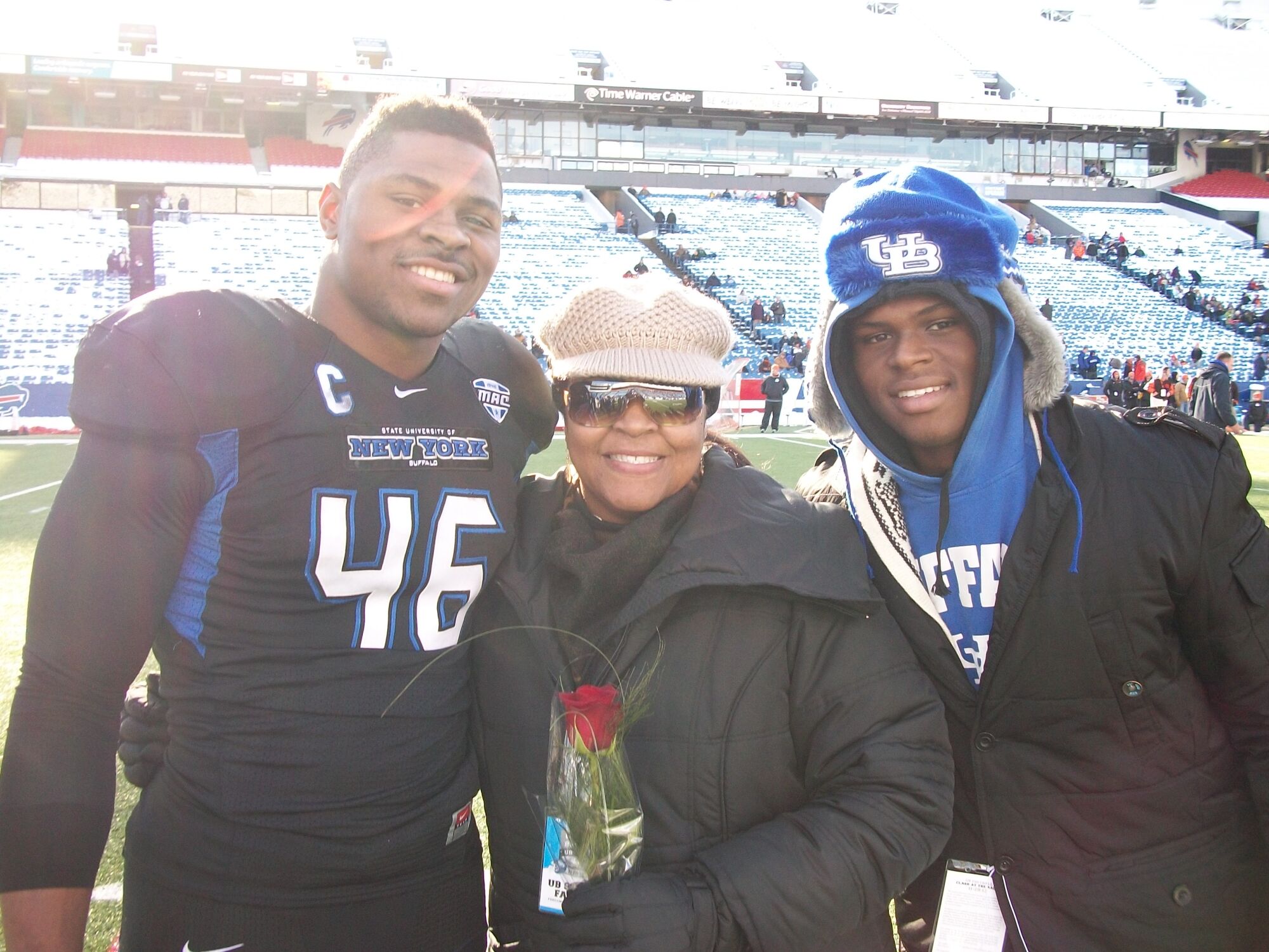 Khalil Mack, left, stands next to his mother, Yolanda, and his brother, Ledarius.