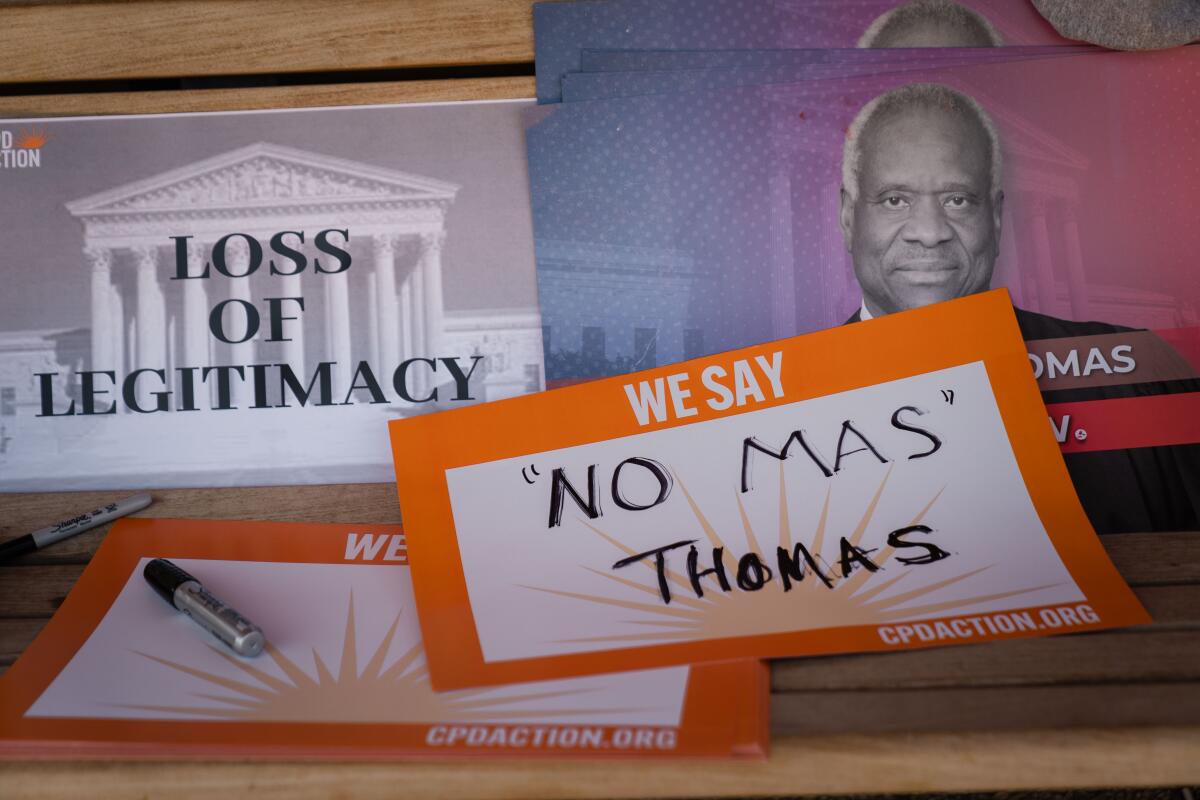 Signs calling on Supreme Court Justice Clarence Thomas to resign are seen at the U.S. Capitol on April 19.