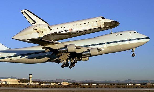 The space shuttle Endeavour takes off from Edwards Air Force Base near Edwards, Calif., piggybacked to a modified 747 on its way back to the Kennedy Space Center in Florida.