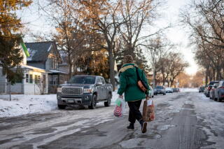 a teacher makes a delivery to a family
