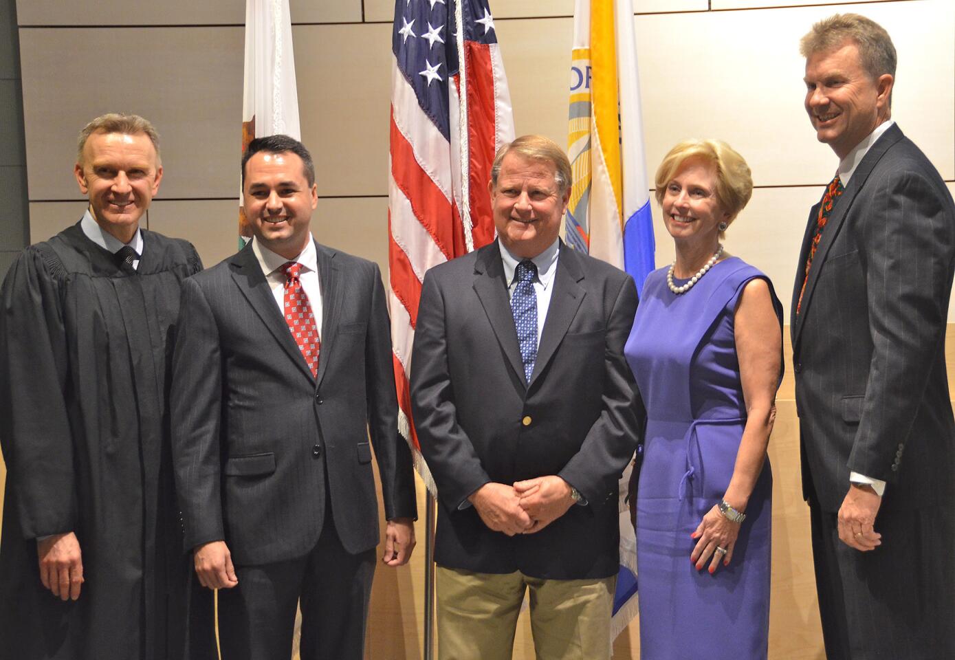 Newly elected Newport Beach City Council members pose with Judge Rogan, from left, Kevin Muldoon, Marshall Duffield, Diane Dixon and Scott Peotter.