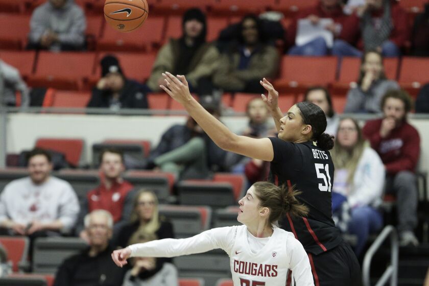 Washington State center Lauren Glazier, bottom, and Stanford center Lauren Betts, top, go after a rebound during the second half of an NCAA college basketball game, Friday, Feb. 3, 2023, in Pullman, Wash. (AP Photo/Young Kwak)