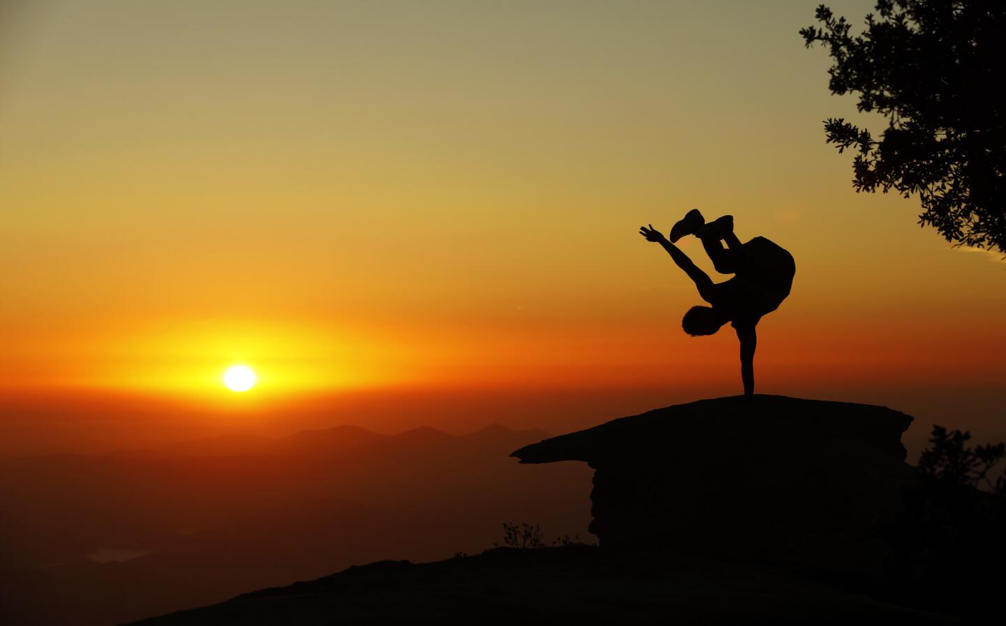 A hiker takes a leap at Potato Chip Rock in Mt. Woodson, northeast of San Diego.