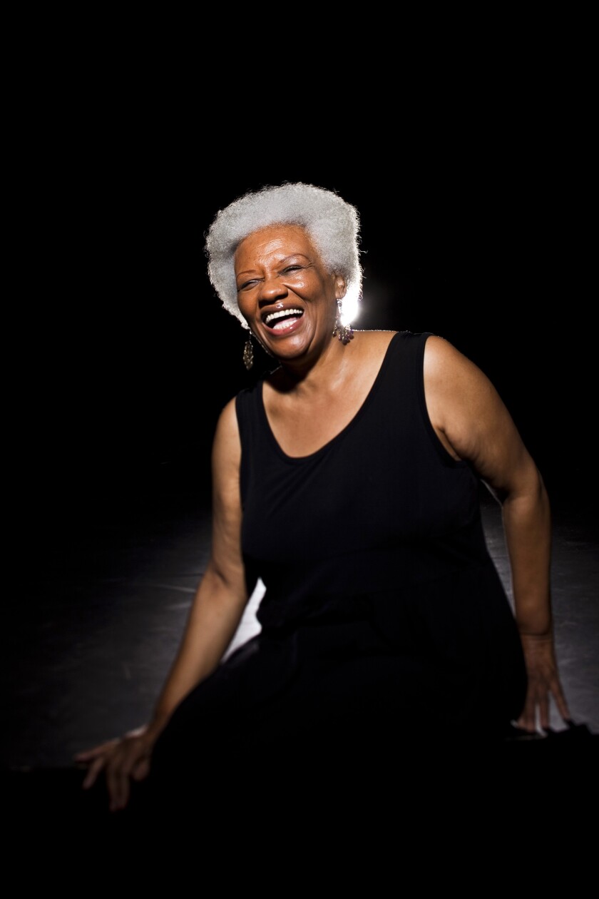  A woman backlit by stage lights