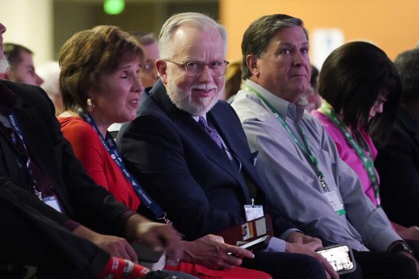 Pastor Ed Litton, center, of Saraland, Ala., attends the annual Southern Baptist Convention meeting Tuesday, June 15, 2021, in Nashville, Tenn. (AP Photo/Mark Humphrey)