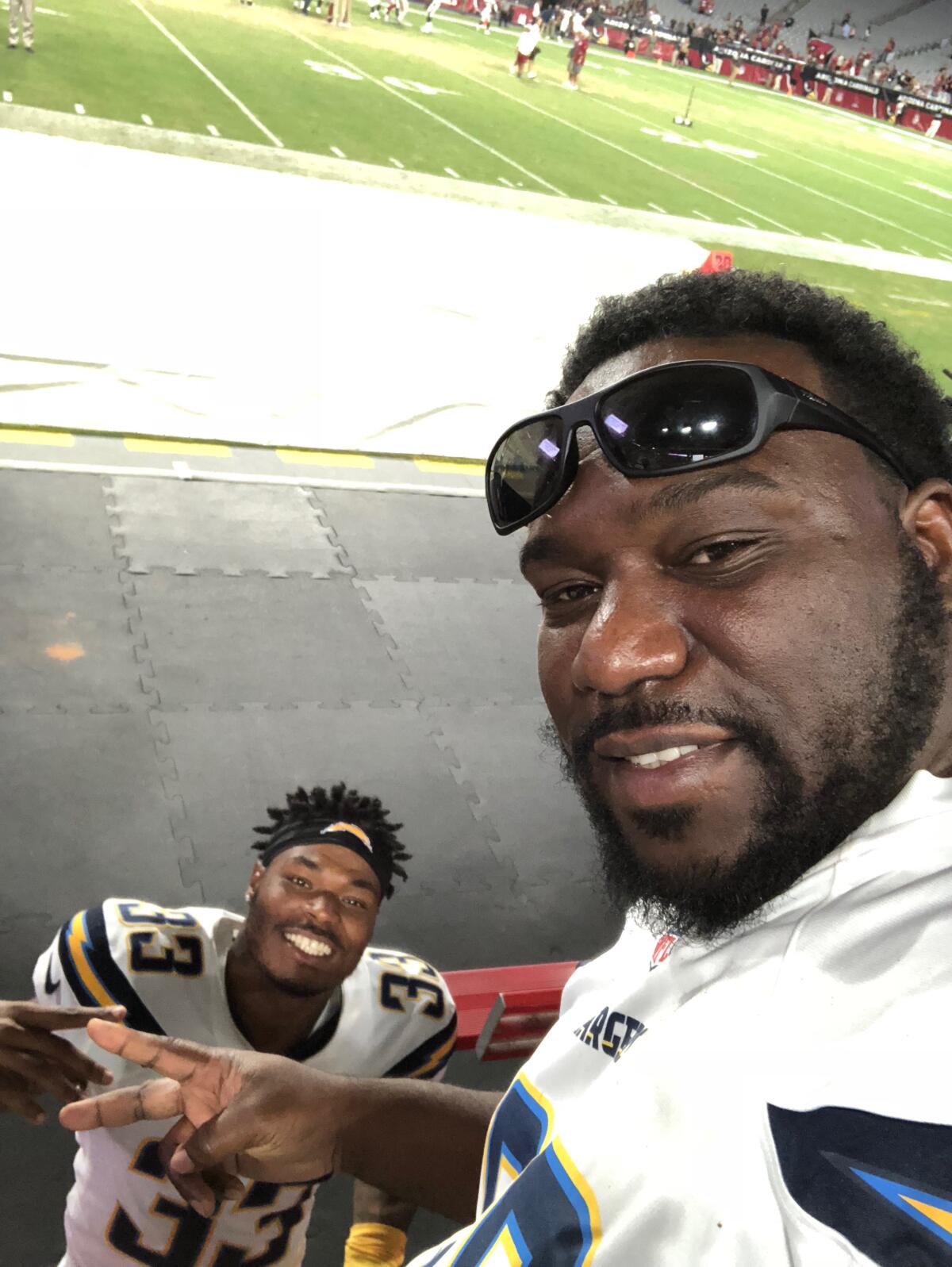 Derwin James Jr. and Derwin Sr. in Arizona after Derwin Jr.'s first preseason game in the NFL in 2018.