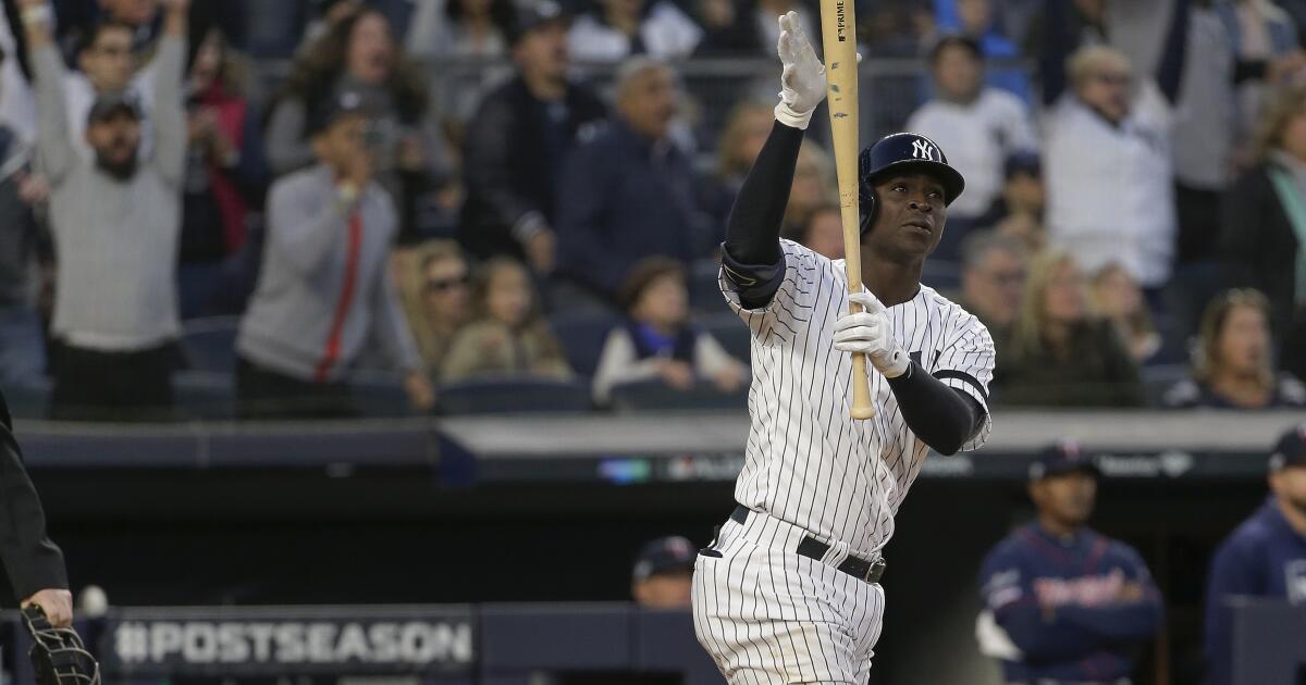 New York Yankees' Didi Gregorius reacts after hitting a grand slam home run  against the Minnesota Twins during the third inning of Game 2 of an  American League Division Series baseball game