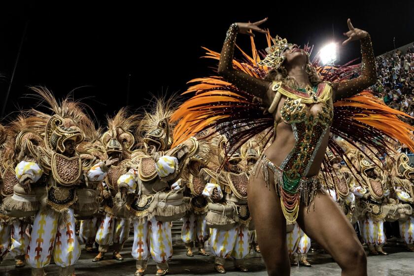 TOPSHOT - Revellers of Unidos da Tijuca samba school perform during the first night of the carnival parade at Sambadrome in Rio de Janeiro, Brazil on February 8, 2016. / AFP / YASUYOSHI CHIBA (Photo credit should read YASUYOSHI CHIBA/AFP/Getty Images)