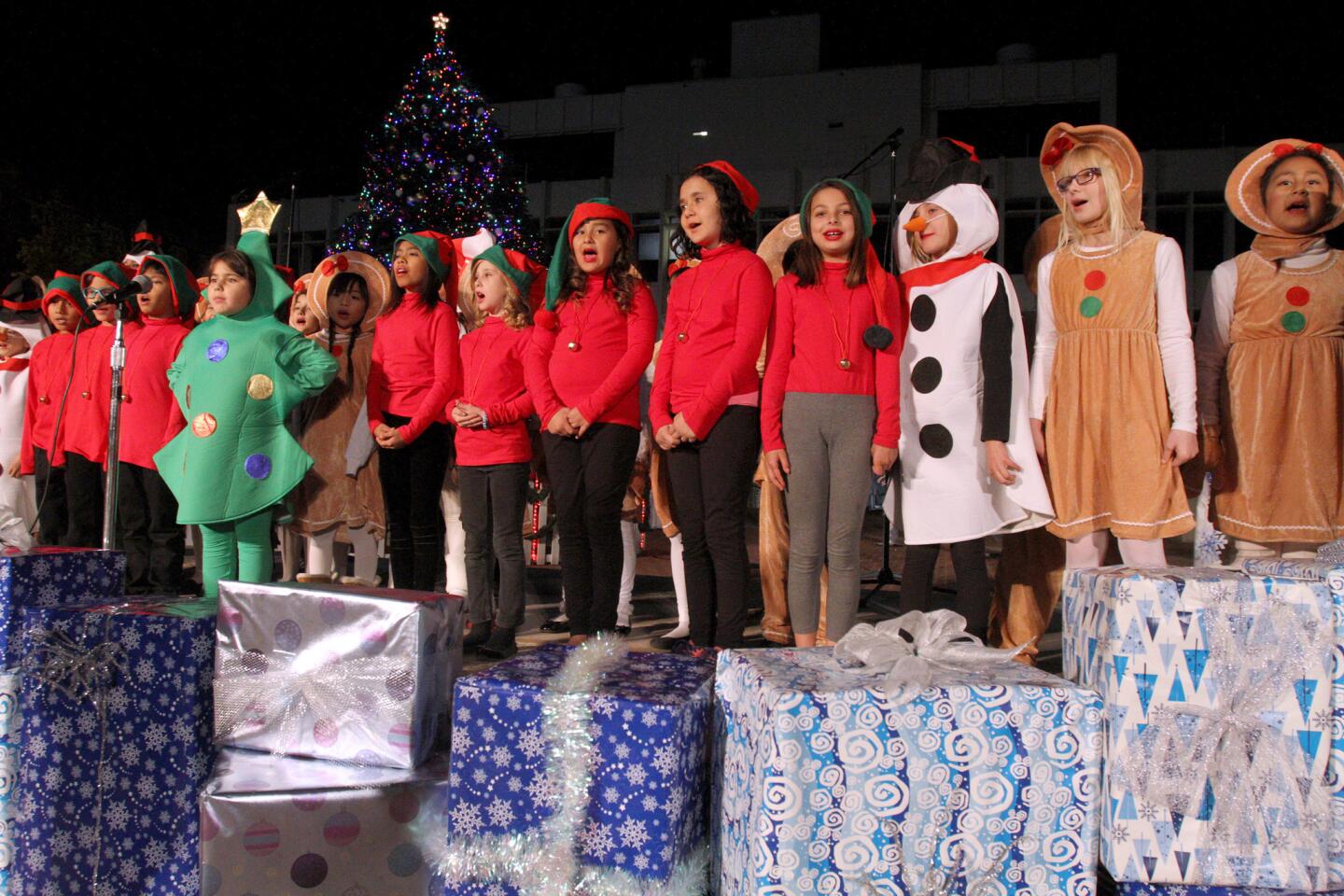 Students from Columbus Elementary School sang Christmas songs at the tree lighting ceremony at Perkins Plaza in Glendale on Wednesday, Dec. 2, 2015.
