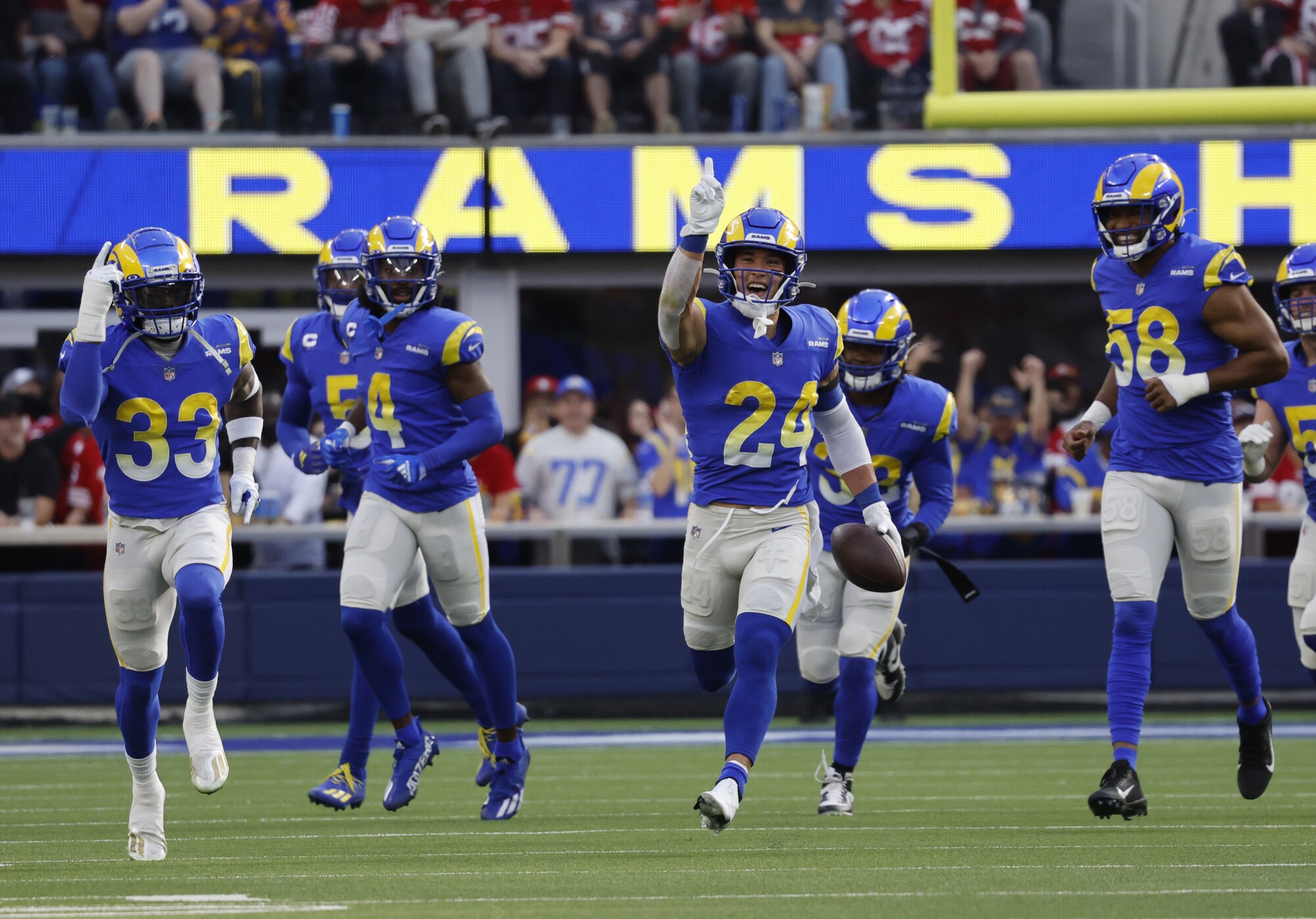 Rams free safety Taylor Rapp (24) runs down the field after an interception