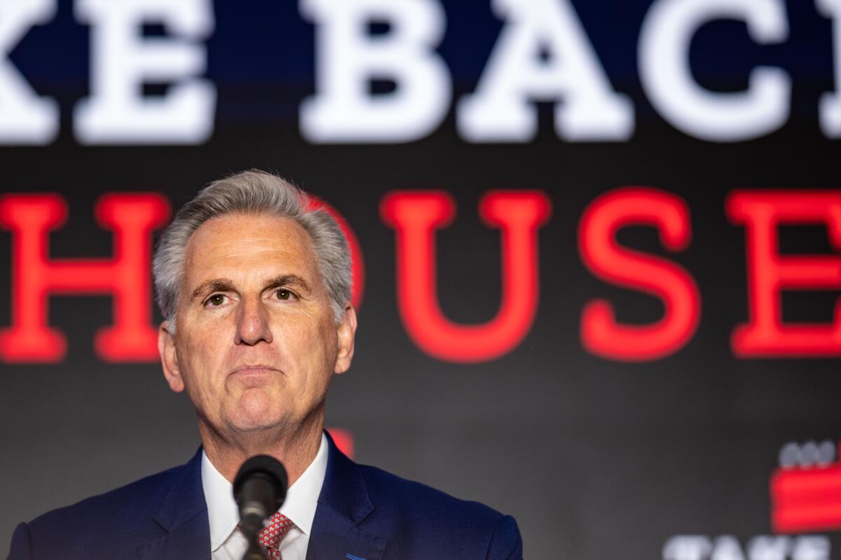 Kevin McCarthy stands at a microphone
