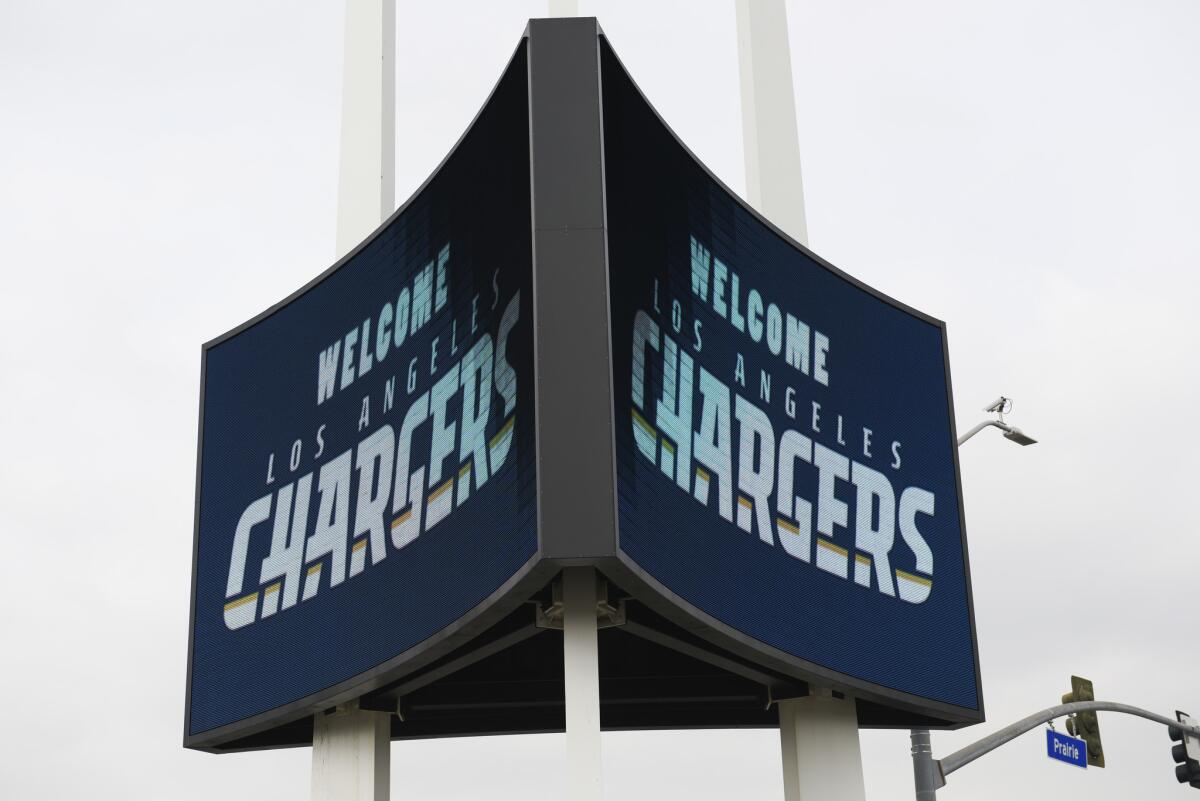A sign is illuminated outside of The Forum to welcome the Los Angeles Chargers prior to their rally in Inglewood.